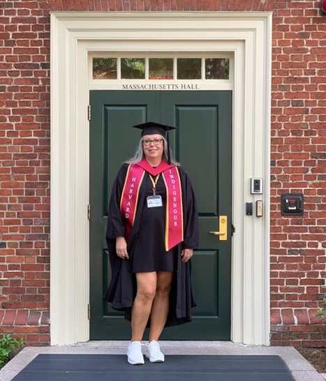 Photo of Laurie in Harvard graduation gown